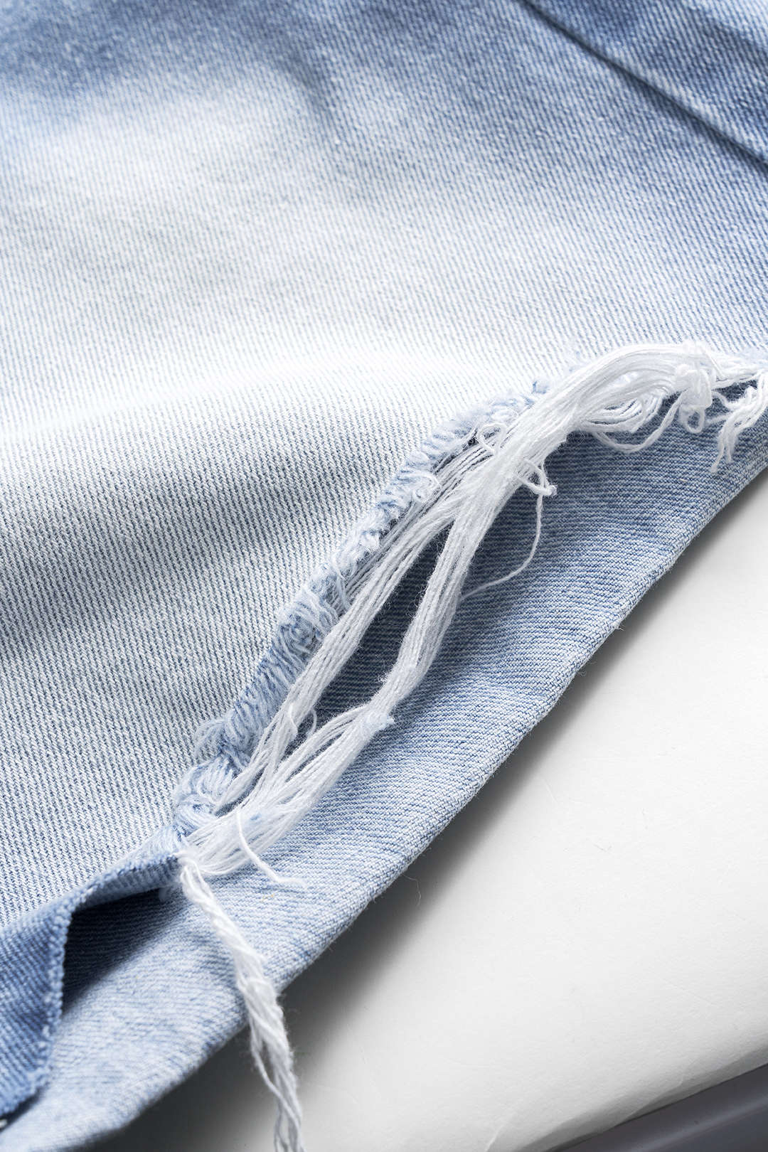Denim Asymmetrical Button Pocket Ripped Shorts - Image 4